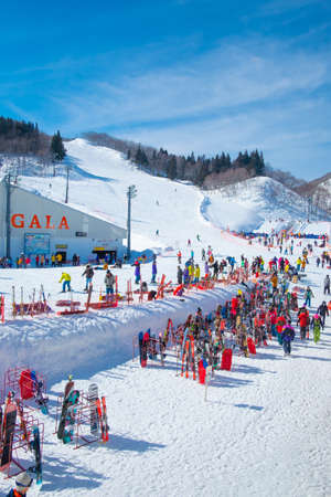 NIIGATA, JAPAN - FEBRUARY 22, 2019: Tourists enjoy to play ski and snowboard at Gala Yuzawa Ski Resort, a large of ski resorts located in Niigata, Japan.のeditorial素材