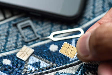 SIM card for smart phone. Changing the SIM card.