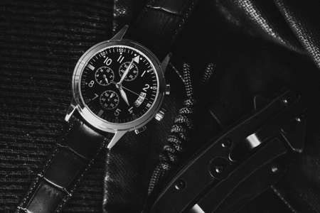 Closeup at luxury men wristwatch with black dial and leather strap.の写真素材