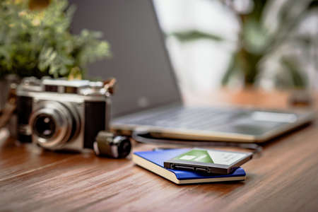 Closeup external hard drive on wooden desktop. Working with external hard drive.
