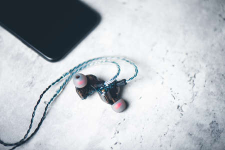 Wired earphones for smartphone and other player. Selective focus on earphone.の写真素材