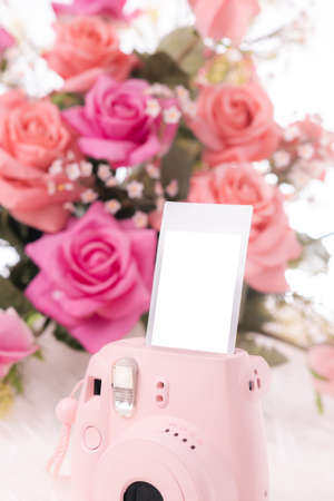 The pink instant camera with blank instant films.の写真素材