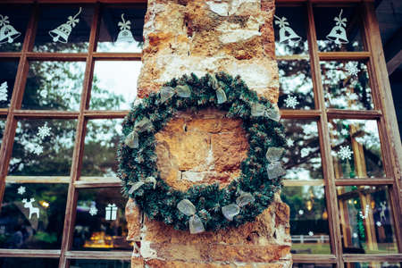 Christmas wreath and bow decoration in winter.  Christmas and New year cerebration.の写真素材