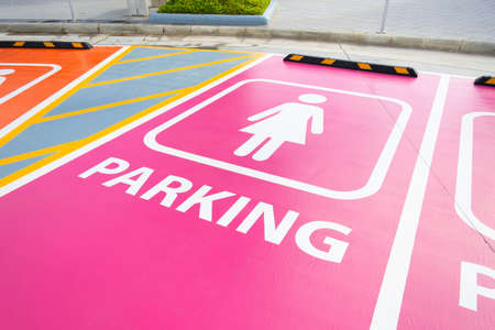 closeup lady parking sign painted on the floor of parking area.