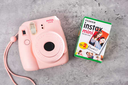 BANGKOK, THAILAND - OCTOBER 11, 2019: The pink Fujifilm Instax mini 8, instant camera with Instax...