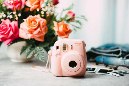 BANGKOK, THAILAND - OCTOBER 11, 2019: The pink Fujifilm Instax mini 8, instant camera with Instax Mini format (54 mm x 86 mm).のeditorial素材