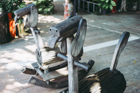 RATCHABURI, THAILAND - JANUARY 03, 2019: Vintage wooden rocking horse at Ban Hom Tien candle shop and cafe.のeditorial素材