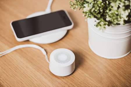 mini wireless portable speaker for music listening. Voice assistant speaker at home.の写真素材