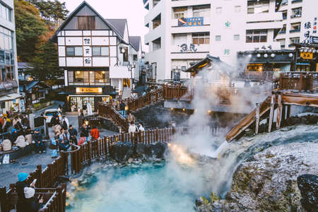 GUNMA, JAPAN - NOVEMBER 04, 2019: Yubatake Onsen, hot spring wooden boxes with mineral water in Kusatsu, Gunma, Japan. The Yubatake is used to cool down the hot spring water.のeditorial素材