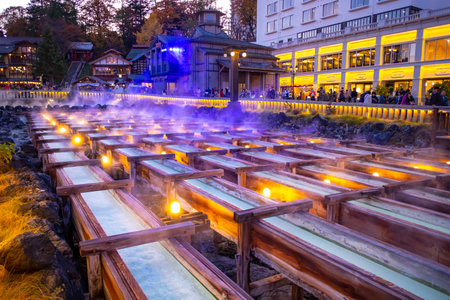 GUNMA, JAPAN - NOVEMBER 04, 2019: Yubatake Onsen, hot spring wooden boxes with mineral water in Kusatsu, Gunma, Japan. The Yubatake is used to cool down the hot spring water.のeditorial素材