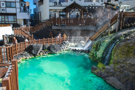GUNMA, JAPAN - NOVEMBER 05, 2019: Yubatake Onsen, hot spring wooden boxes with mineral water in Kusatsu, Gunma, Japan. The Yubatake is used to cool down the hot spring water.のeditorial素材