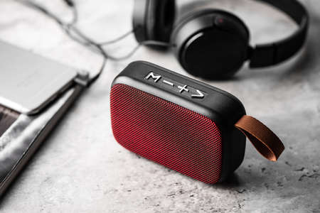 relaxing concept, close up red wireless portable speaker for music listening.