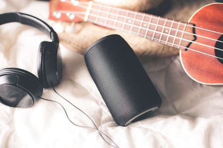 relaxing concept, Using wireless portable speaker on the bed.の写真素材