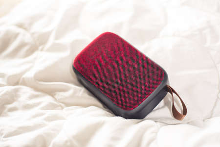 relaxing concept, Using wireless portable speaker on the bed.の写真素材