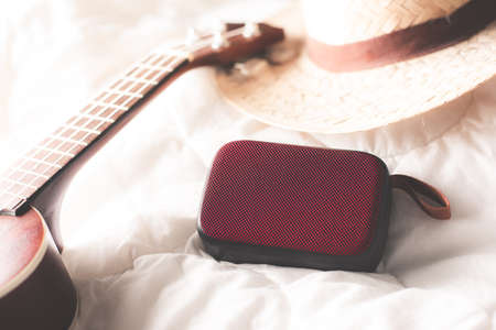 relaxing concept, Using wireless portable speaker on the bed.の写真素材