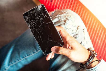 closeup cracked screen on broken smart phone.の写真素材