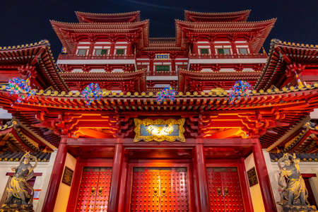 SINGAPORE - MAY 10, 2019: The facade of Buddha Tooth Relic Temple at night in Chinatown, Singapore.