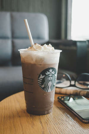 CHONBURI, THAILAND - JANUARY 23, 2020: A cup of Iced Signature Chocolate from Starbucks coffee shop. Starbucks is the world's largest coffee house with over 20,000 stores in 61 countries.のeditorial素材