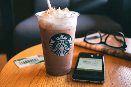 CHONBURI, THAILAND - JANUARY 23, 2020: A cup of Iced Signature Chocolate from Starbucks coffee shop. Starbucks is the world's largest coffee house with over 20,000 stores in 61 countries.のeditorial素材