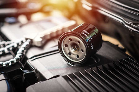 The new car oil filter and chain wrench. Automotive spare part.  Car maintenance concept.