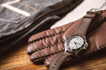 Close up at casual men wristwatch with cream dial and leather strap. Men accessories concept.の写真素材