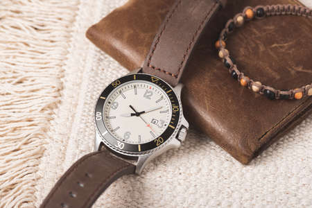 Close up at casual men wristwatch with cream dial and leather strap. Men accessories concept.の写真素材