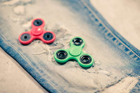 Plastic fidget spinner toy, stress and anxiety relieving toy.の写真素材