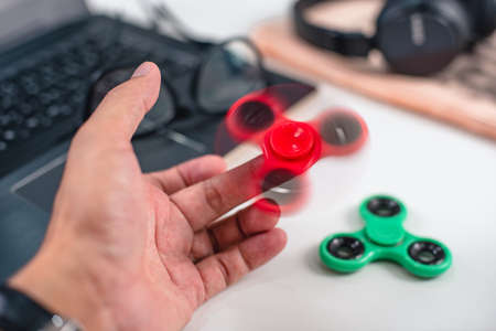 Plastic fidget spinner toy, stress and anxiety relieving toy.