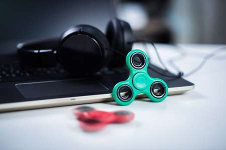 Plastic fidget spinner toy, stress and anxiety relieving toy.の写真素材