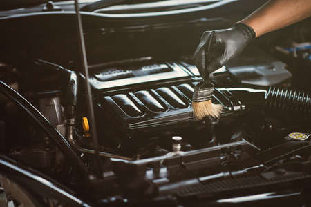 Cleaning the engine bay. Car cleaning and car detailing concept.の写真素材