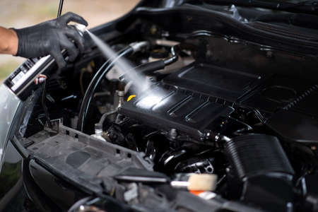 Cleaning the engine bay. Car cleaning and car detailing concept.の写真素材