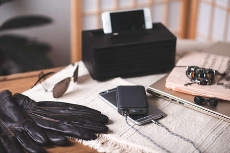 Smartphone battery charging with power bank. close-up at the grey power bank.の写真素材
