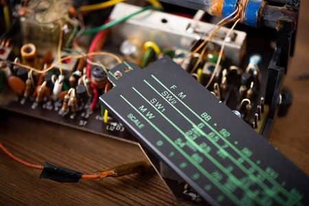 Close up the parts of vintage radio. Radio repair and restoration concept.