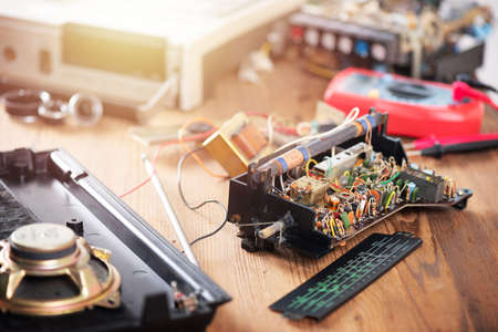 Close up the parts of vintage radio cassette recorder. Radio repair and restoration concept.