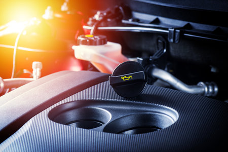 closeup engine oil cap in engine room, car maintenance concept