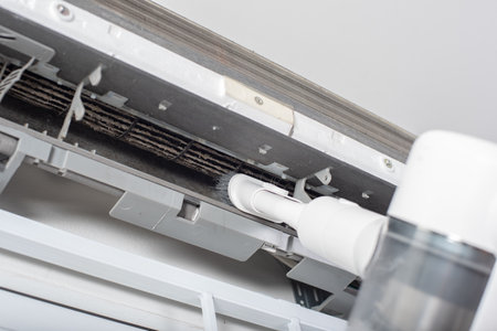 Cleaning air conditioner indoor unit. Maintaining the air conditioner concept.の写真素材
