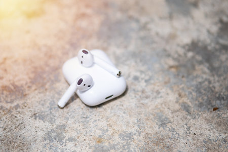 Pair of white wireless earbuds for smartphone. Relaxation concept.の写真素材