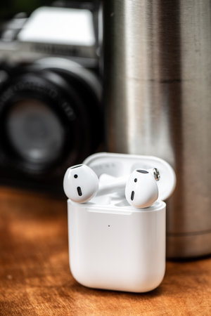 Pair of white wireless earbuds for smartphone. Relaxation concept.の写真素材