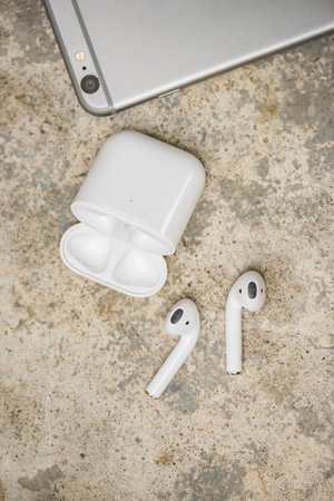 Pair of white wireless earbuds for smartphone. Relaxation concept.の写真素材