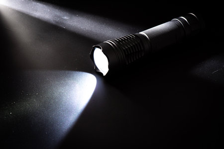 Black pocket flashlight for Everyday Carry (EDC).