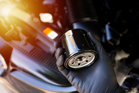 The new car oil filter, automotive spare part, car maintenance concept.の写真素材
