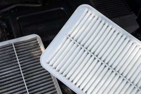 Changing car air filter, close up at the new and clean air filter. Car maintenance concept.の写真素材