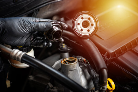 Technician opening the motor oil cap. Car maintenance concept.の写真素材