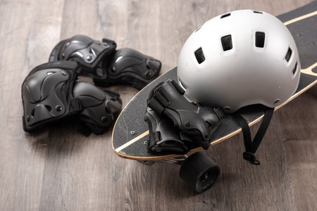 Surfskate and protective gear, helmet, knee pad, elbow pad.の写真素材