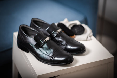 Cleaning the black leather shoes. Shoe care concept.の写真素材