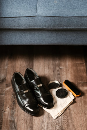 Cleaning the black leather shoes. Shoe care concept.の写真素材