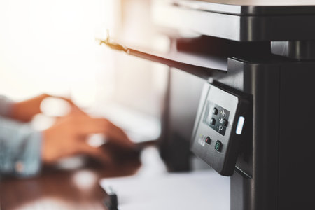The multi-function laser printer on the desktop.の写真素材