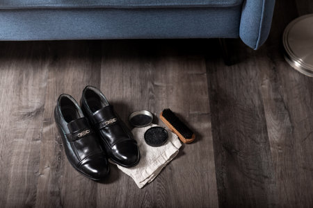 Cleaning the black leather shoes. Shoe care concept.の写真素材