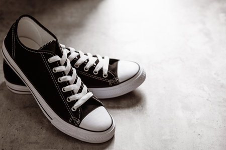 Pair of new black and white canvas sneakers.の写真素材