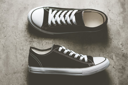 Pair of new black and white canvas sneakers.